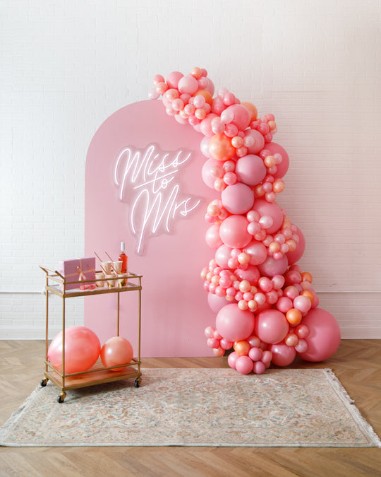 Rosé Bubbles - The Aadi Panel with Garland and Neon Sign