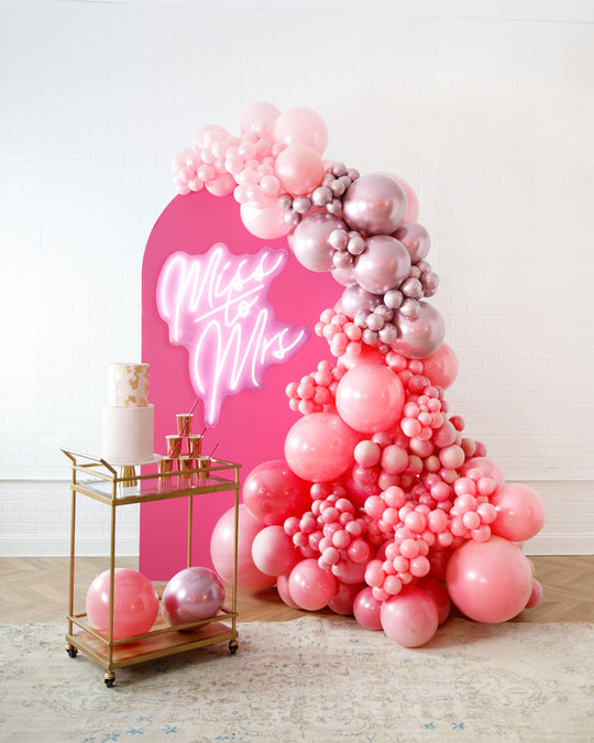 Life In Plastic - The Aadi Panel with Garland and Neon Sign