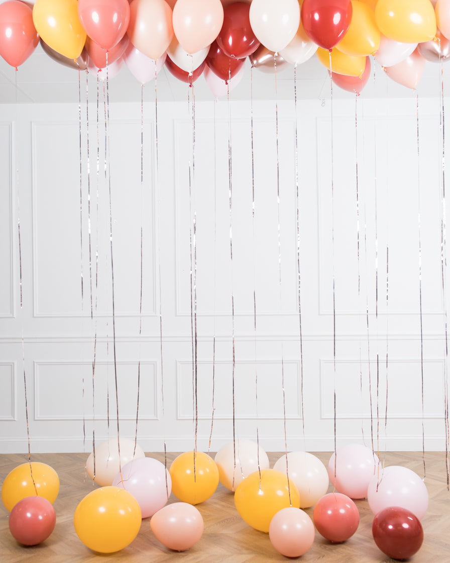 bohemian-birthday-balloon-coral-pink-ceiling-floor-party