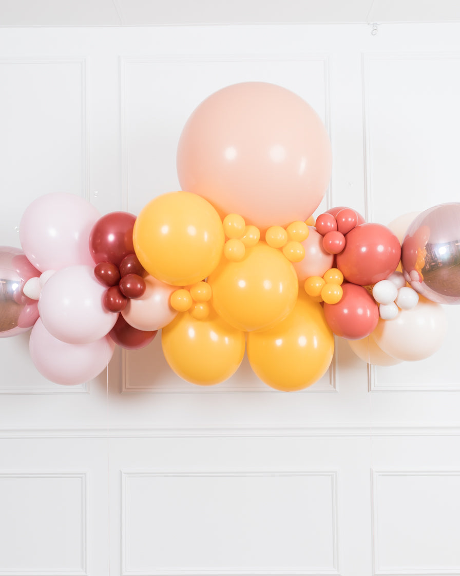 bohemian-birthday-balloon-coral-pink-floating-arch-foil-party