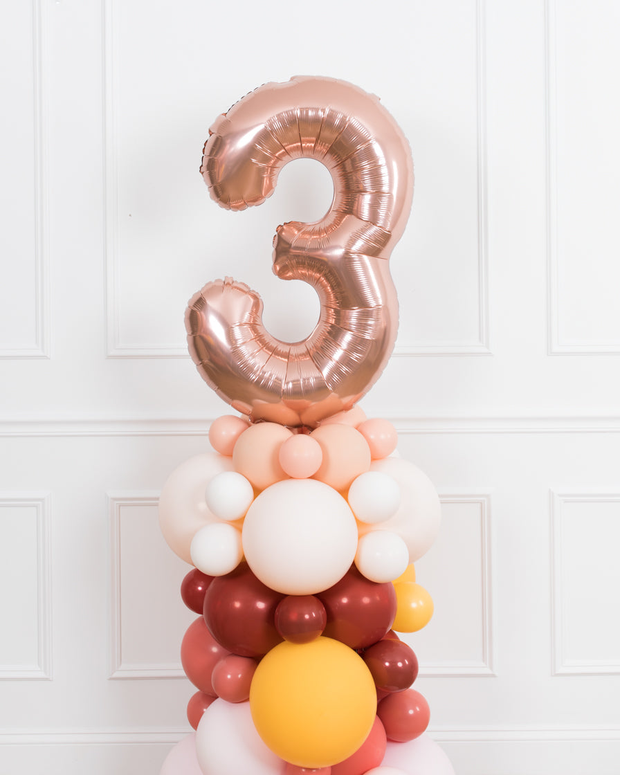 bohemian-birthday-balloon-coral-pink-number-column-party