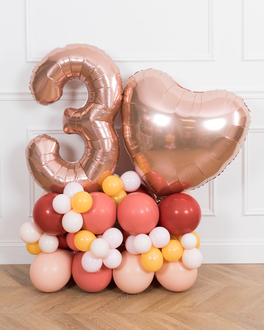 bohemian-birthday-balloon-coral-pink-number-pedestal-party