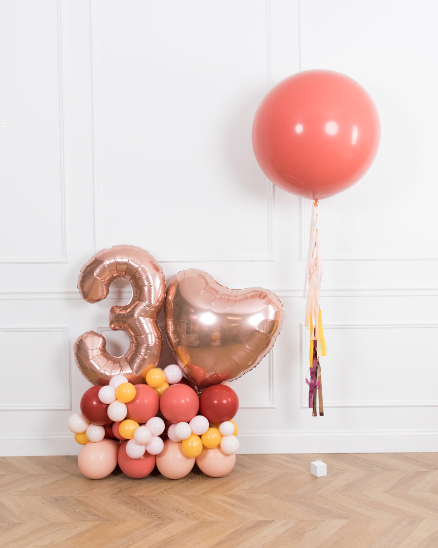 bohemian-birthday-balloon-coral-pink-number-pedestal-party