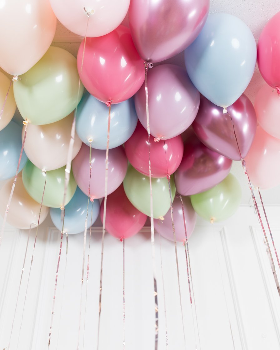 Colourful balloons, pink, white, streamers. Helium Ballon floating