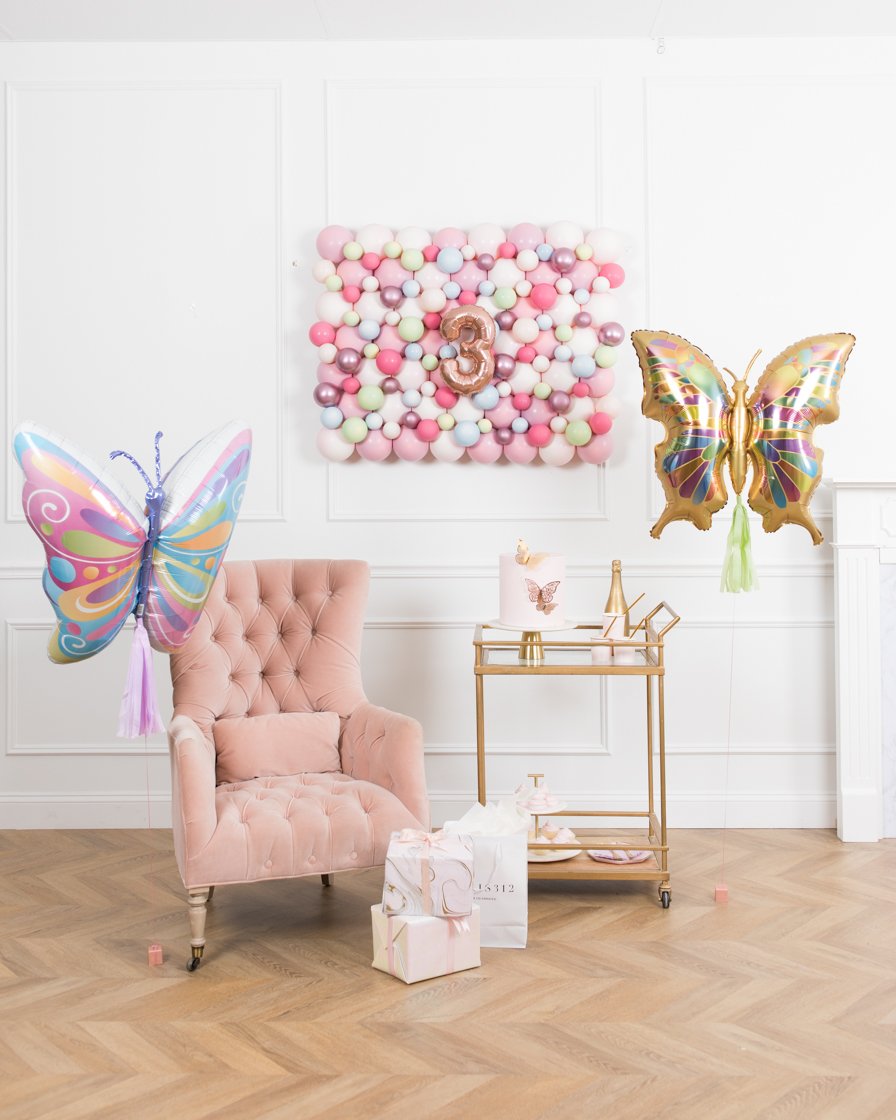 butterfly-foil-balloon-rose-gold-backdrop-number-board